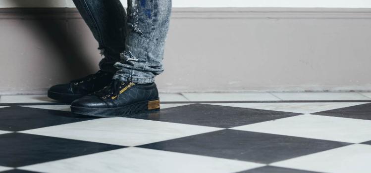 feet on black and white tiles